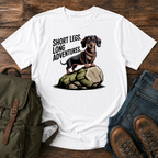 Dachshund wearing a tiny harness standing proudly on top of one oversized boulder t-shirt design