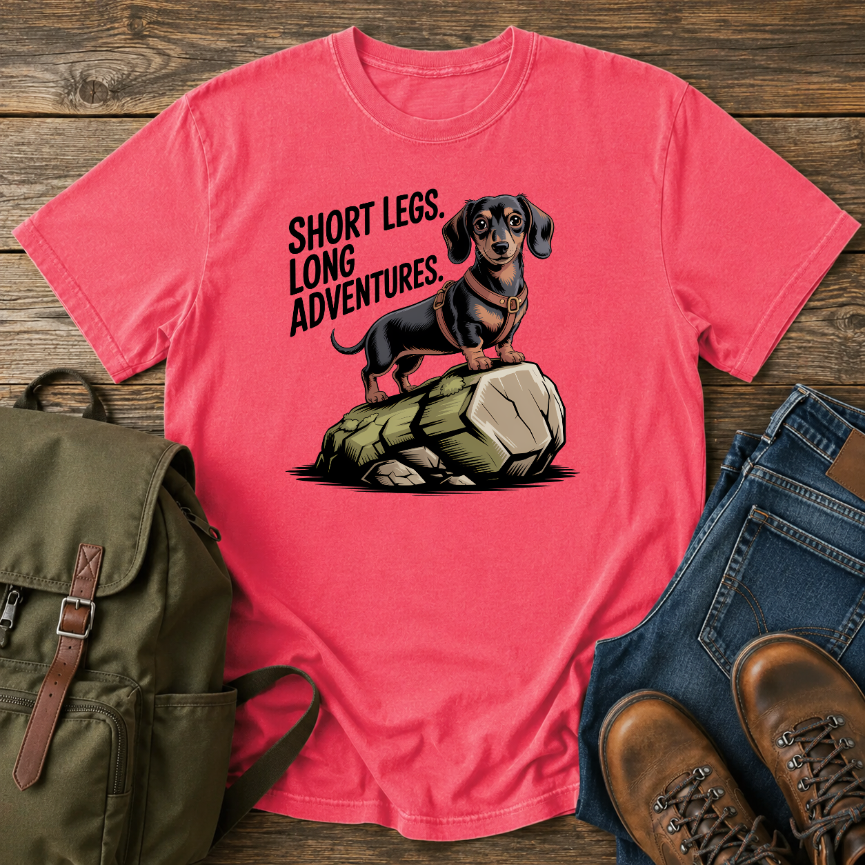 Dachshund in a trail harness standing on a large boulder on a vintage adventure t-shirt design.