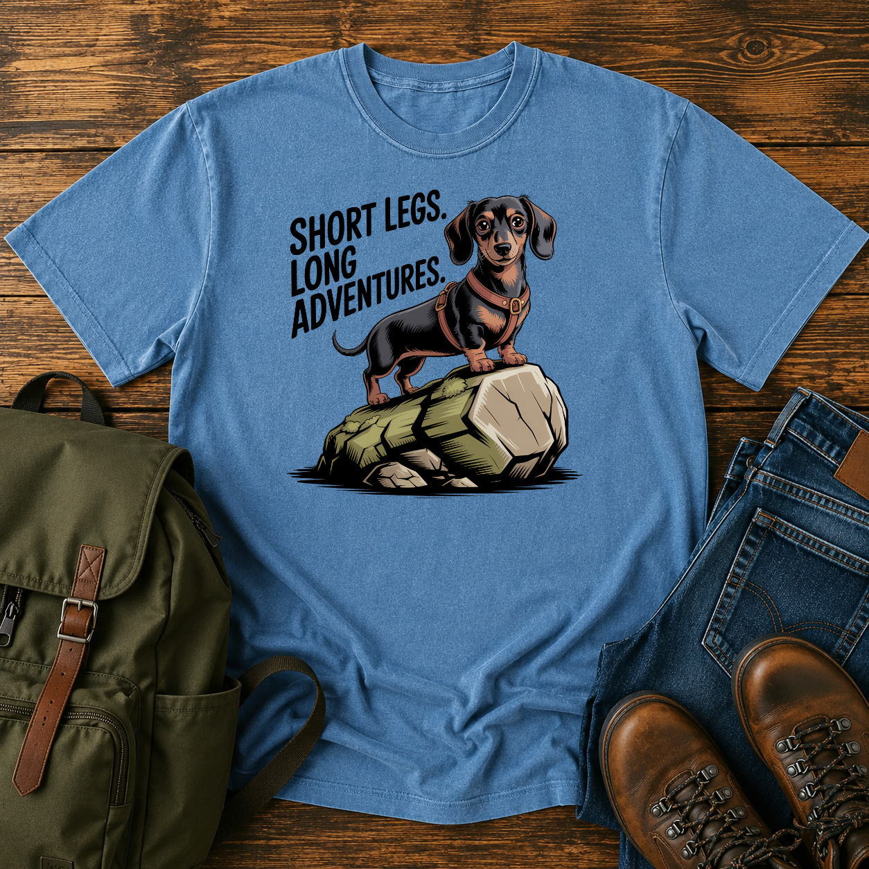 Dachshund in a trail harness standing on a large boulder on a vintage adventure t-shirt design.