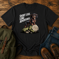 Dachshund in a trail harness standing on a large boulder on a vintage adventure t-shirt design.