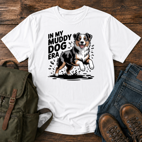 Australian Shepherd dog shaking off muddy creek water on a retro outdoor t-shirt design.