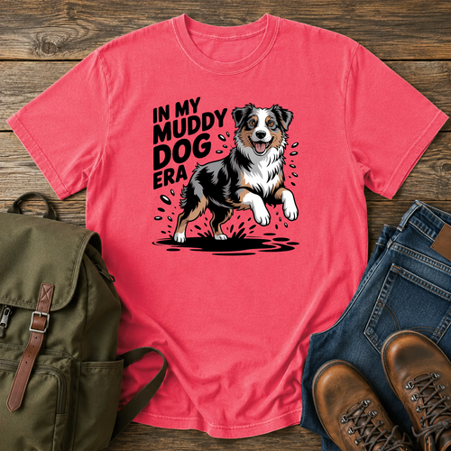 Australian Shepherd dog shaking off muddy creek water on a retro outdoor t-shirt design.