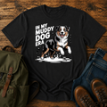 Australian Shepherd dog shaking off muddy creek water on a retro outdoor t-shirt design.