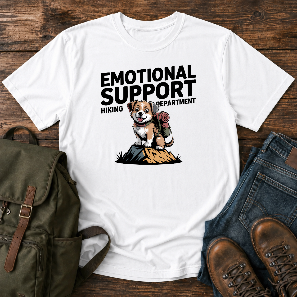Scruffy rescue mutt riding in a backpack at a summit marker on a funny hiking t-shirt design.
