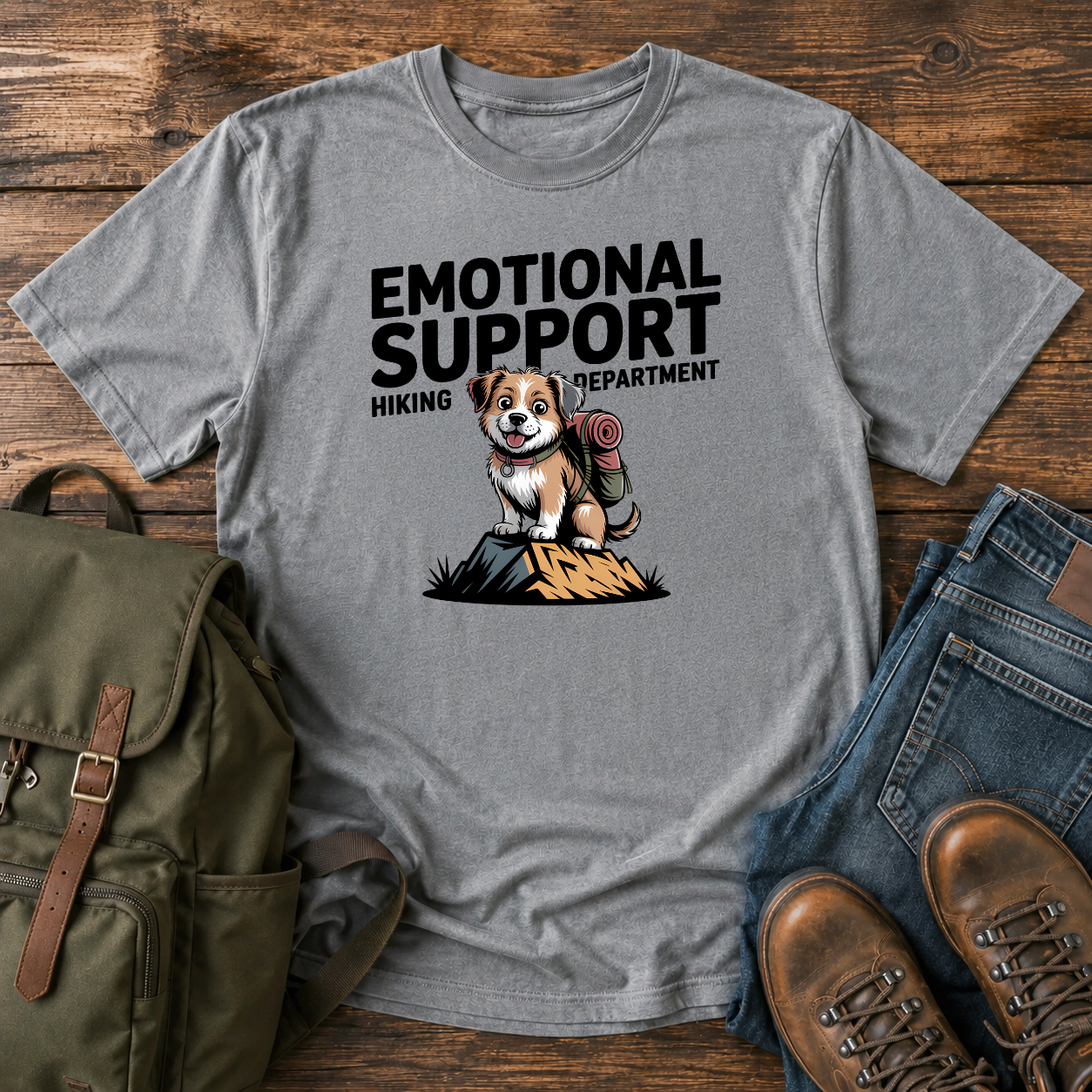 Scruffy rescue mutt riding in a backpack at a summit marker on a funny hiking t-shirt design.