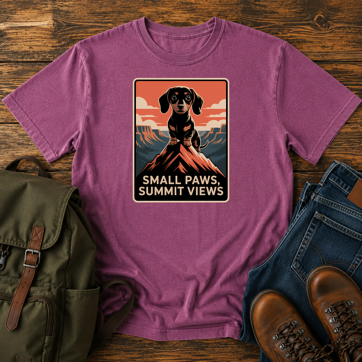 Dachshund standing on a mountain summit in a vintage national-park poster t-shirt design.