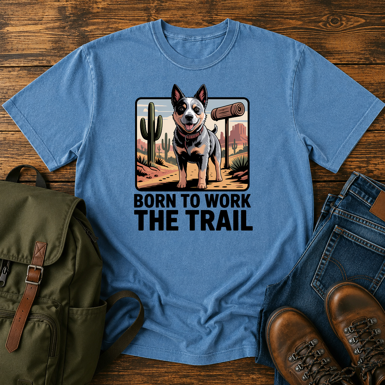 Australian Cattle Dog on rocky desert trail with vintage trail marker and bedroll on t-shirt