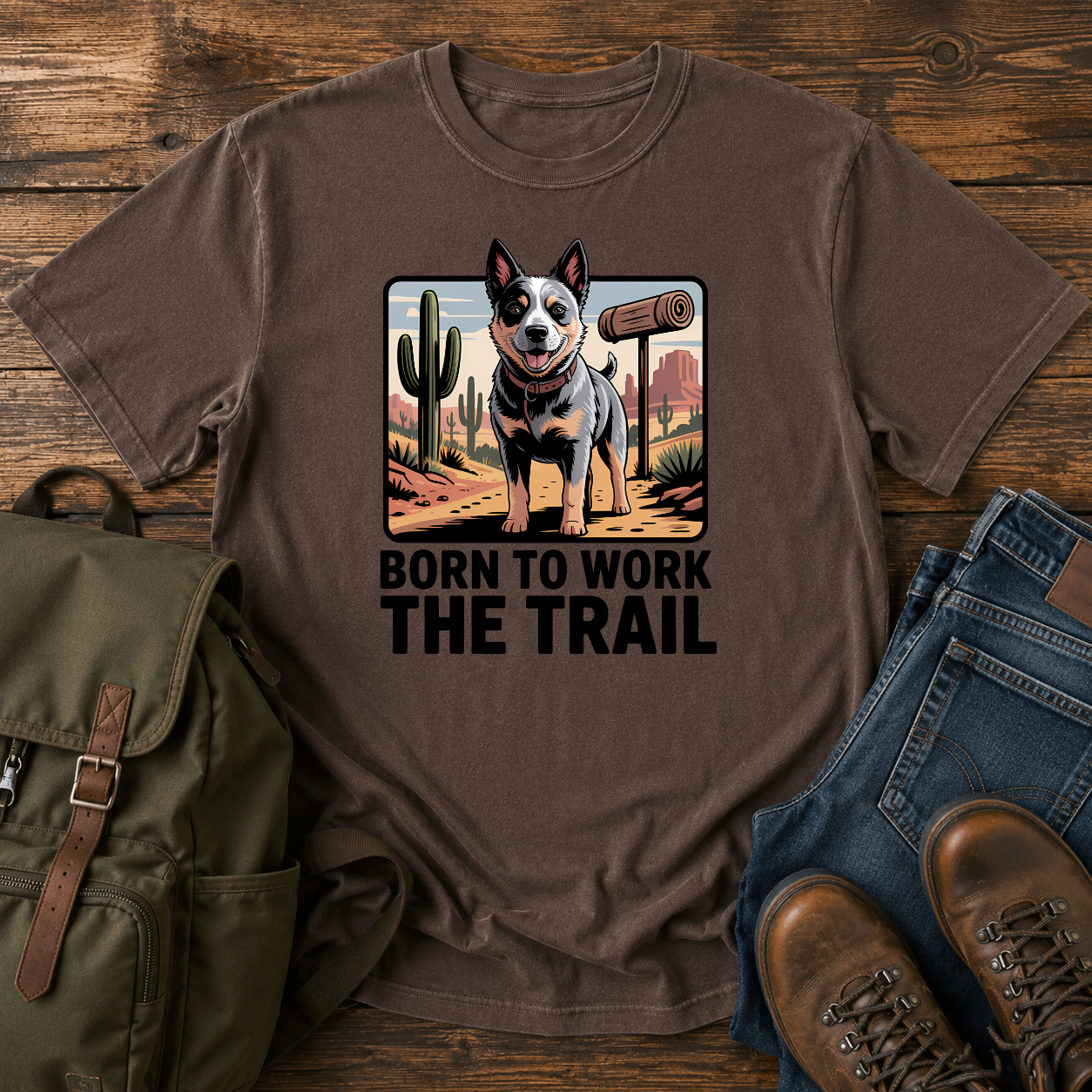 Australian Cattle Dog on rocky desert trail with vintage trail marker and bedroll on t-shirt