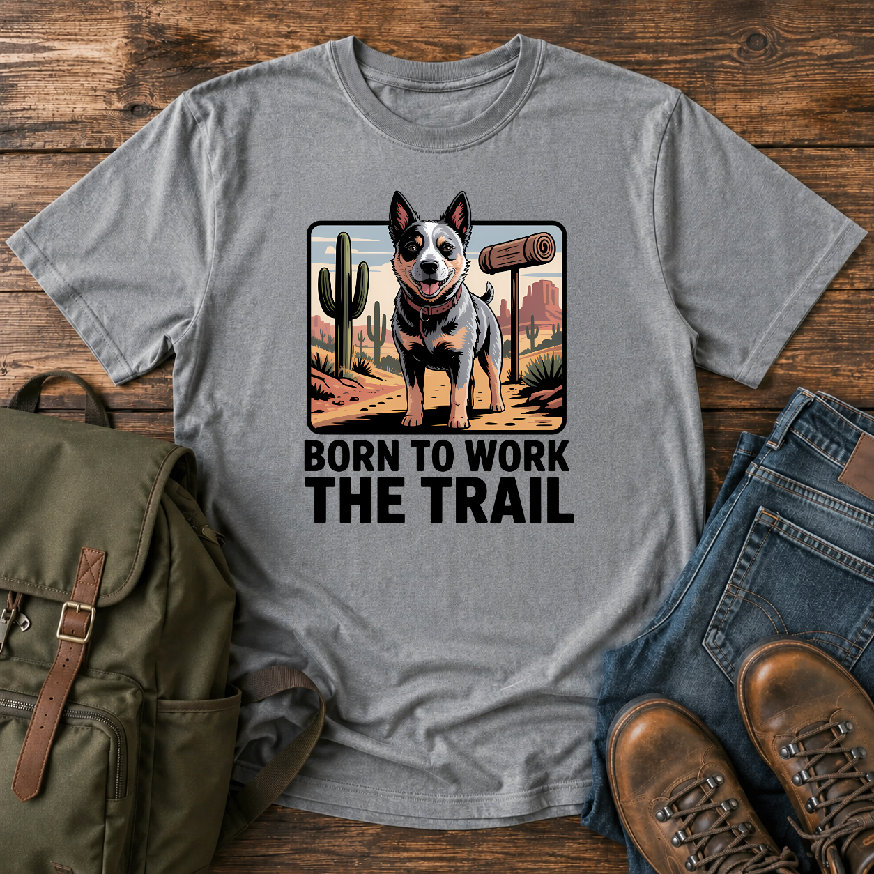Australian Cattle Dog on rocky desert trail with vintage trail marker and bedroll on t-shirt