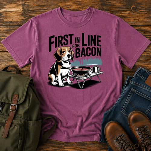 Beagle sitting eagerly beside a cast-iron skillet on a camp stove, ears flopped t-shirt design