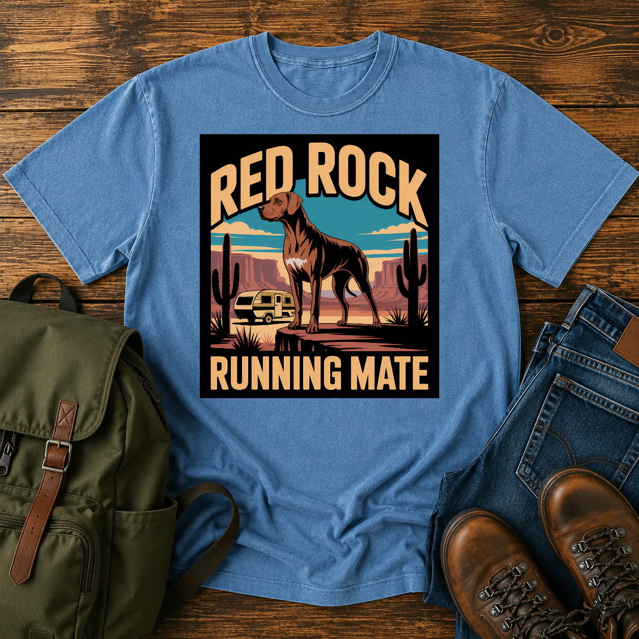 Rhodesian Ridgeback standing on red-rock canyon overlook with vintage teardrop camper and saguaro cacti on t-shirt