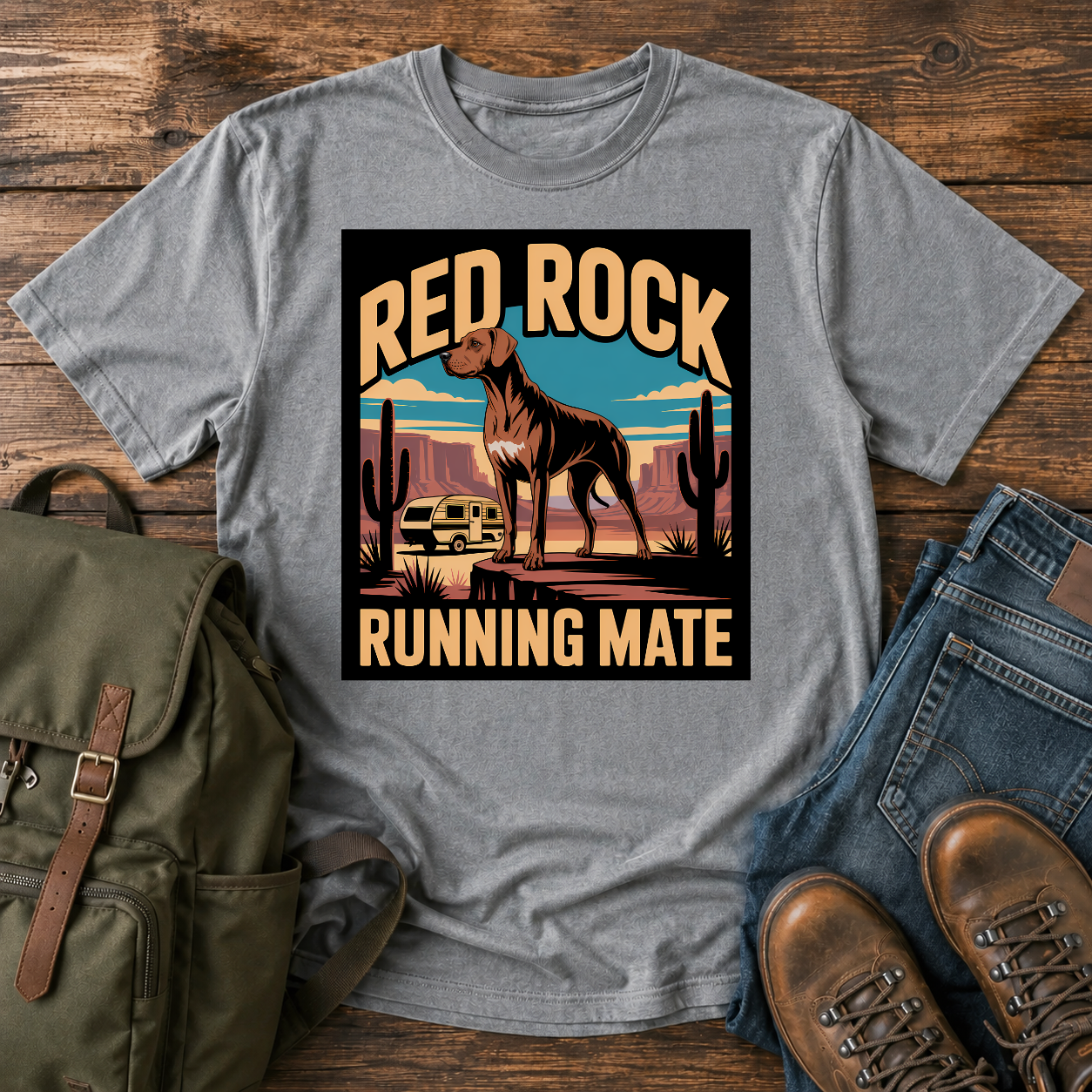Rhodesian Ridgeback standing on red-rock canyon overlook with vintage teardrop camper and saguaro cacti on t-shirt