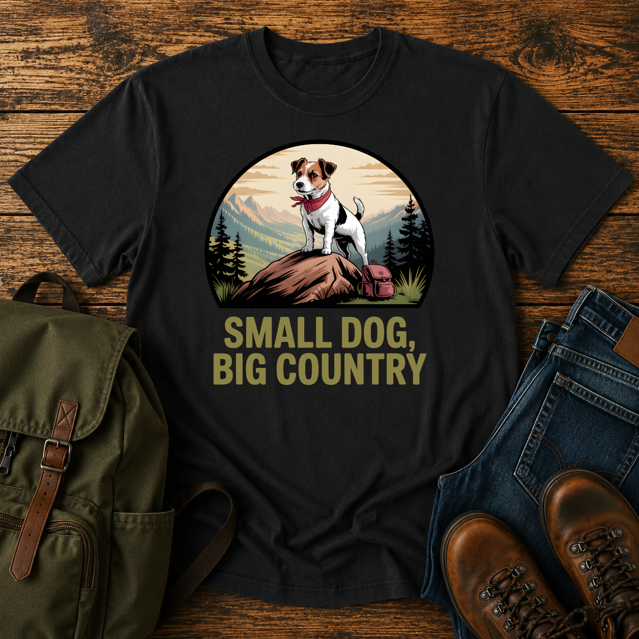 Jack Russell Terrier standing atop a mountain boulder with bandana flapping in the wind on a vintage trail t-shirt.