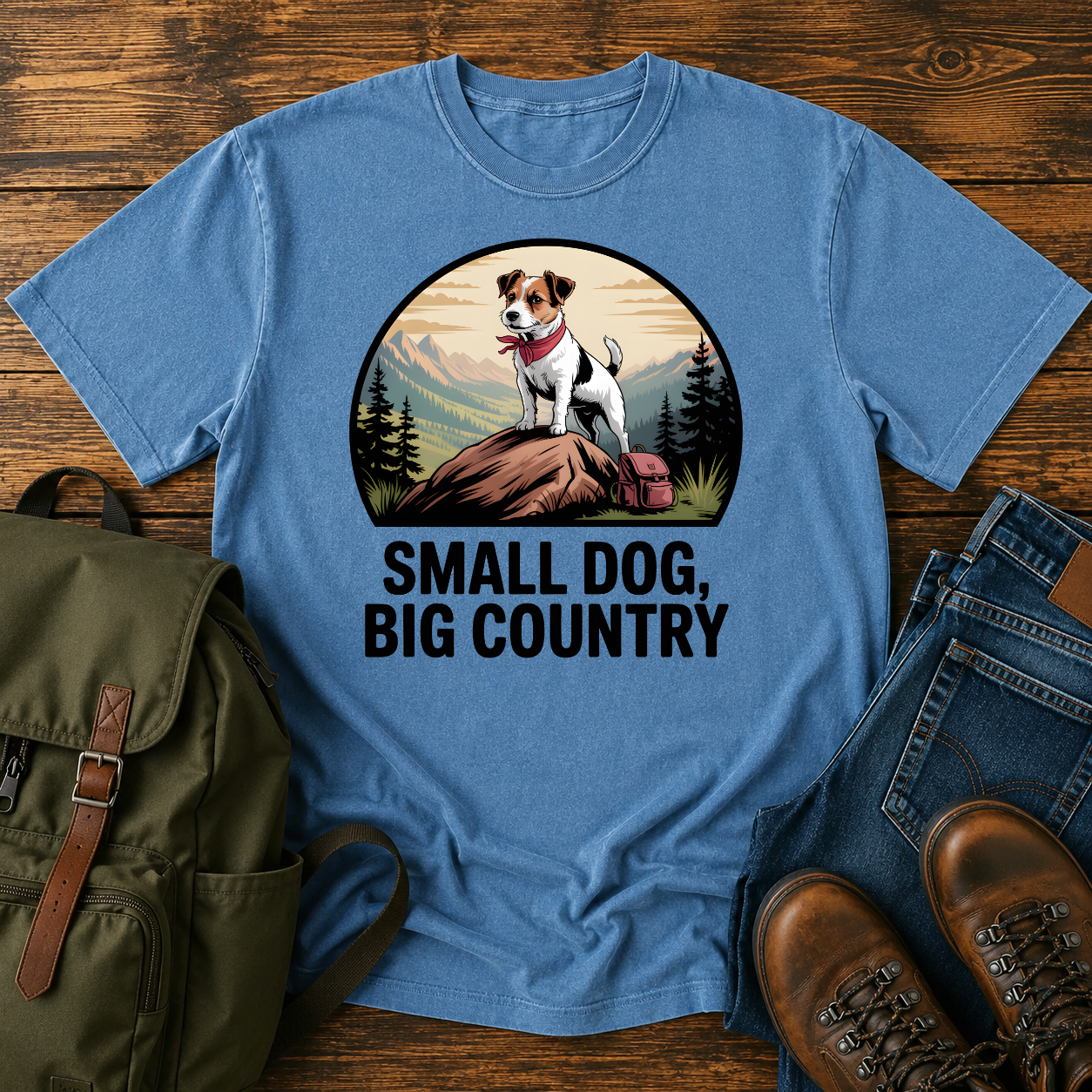 Jack Russell Terrier standing atop a mountain boulder with bandana flapping in the wind on a vintage trail t-shirt.
