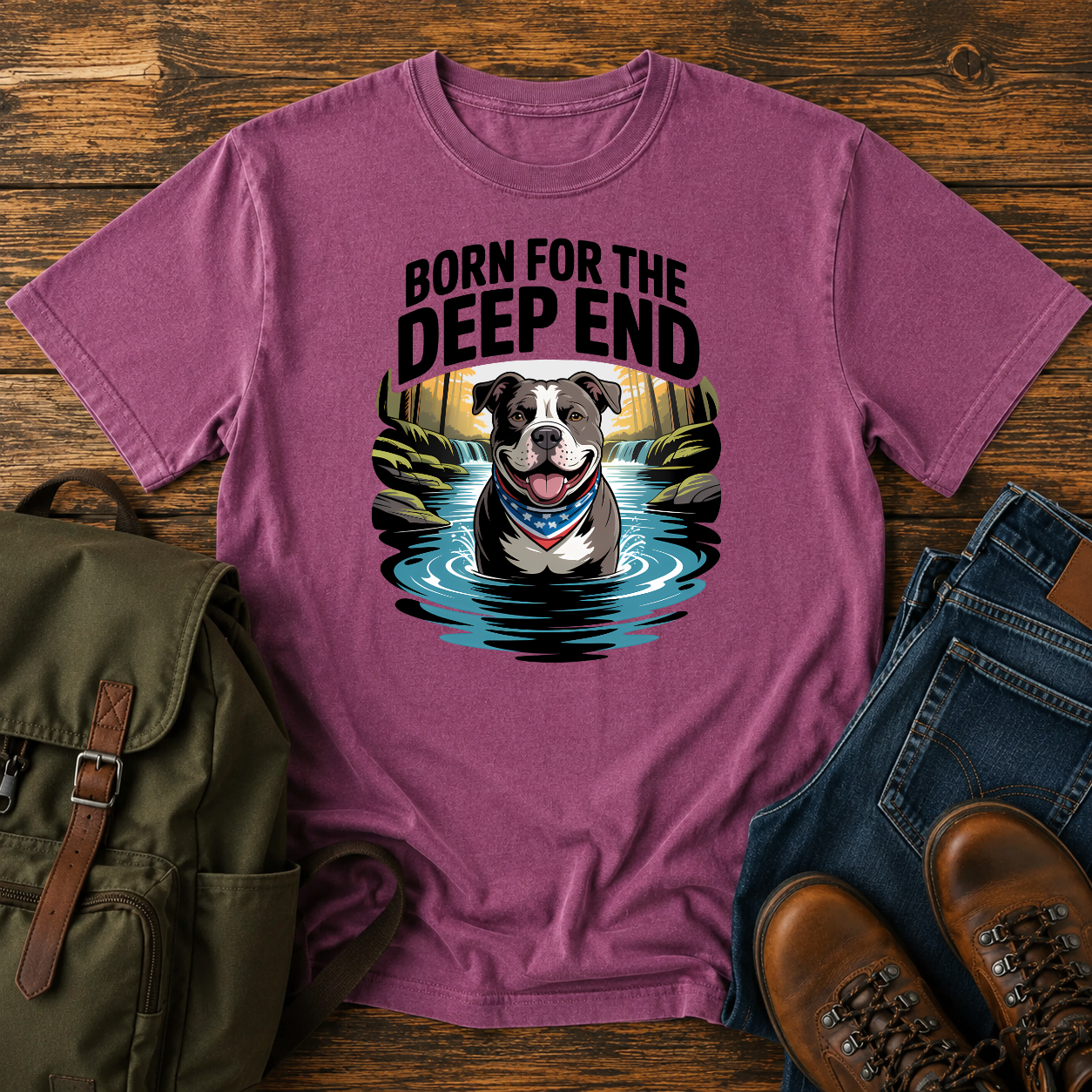 Smiling American Pit Bull Terrier with patriotic bandana standing in waterfall swimming hole on a vintage t-shirt.