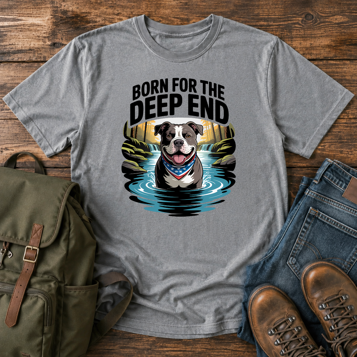 Smiling American Pit Bull Terrier with patriotic bandana standing in waterfall swimming hole on a vintage t-shirt.
