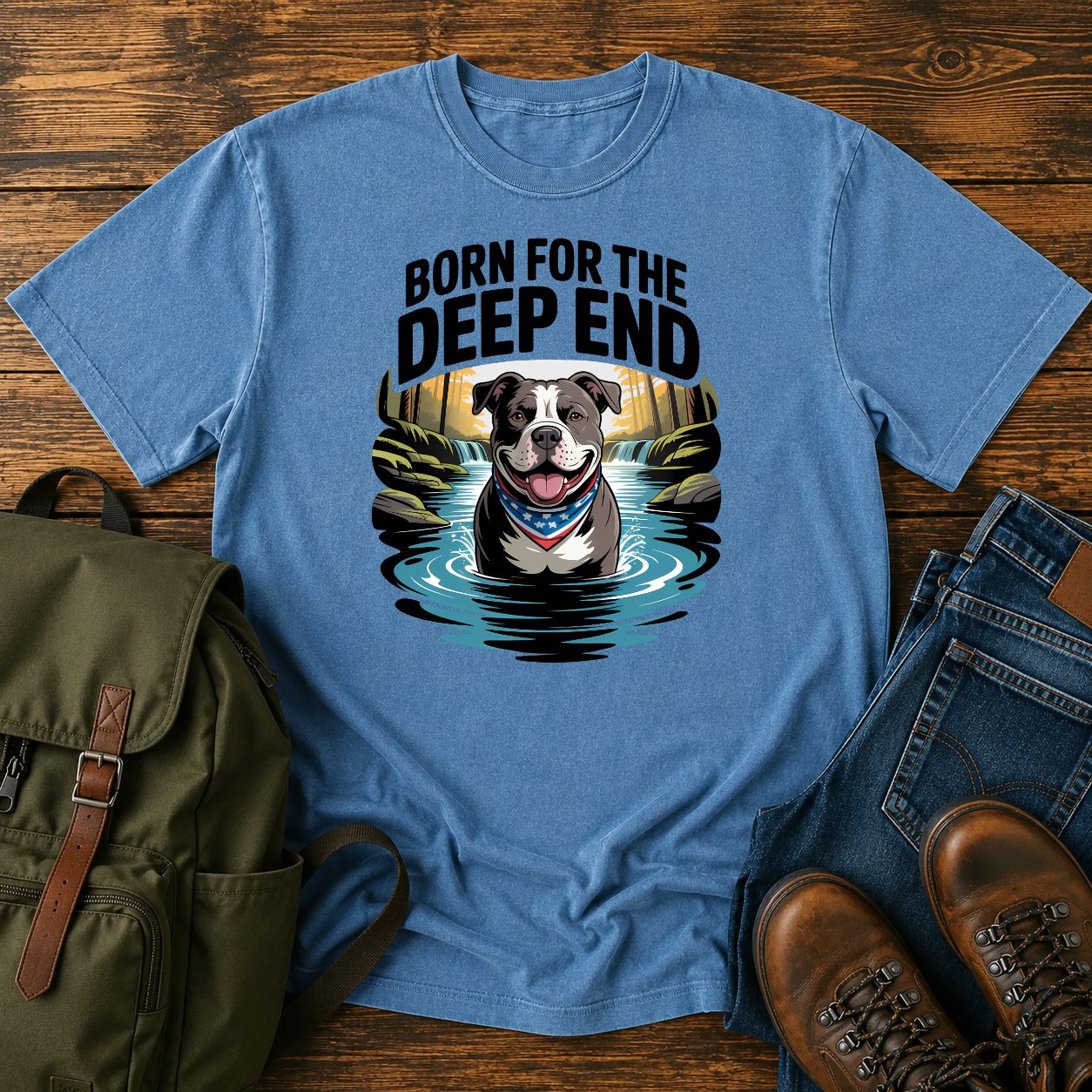 Smiling American Pit Bull Terrier with patriotic bandana standing in waterfall swimming hole on a vintage t-shirt.