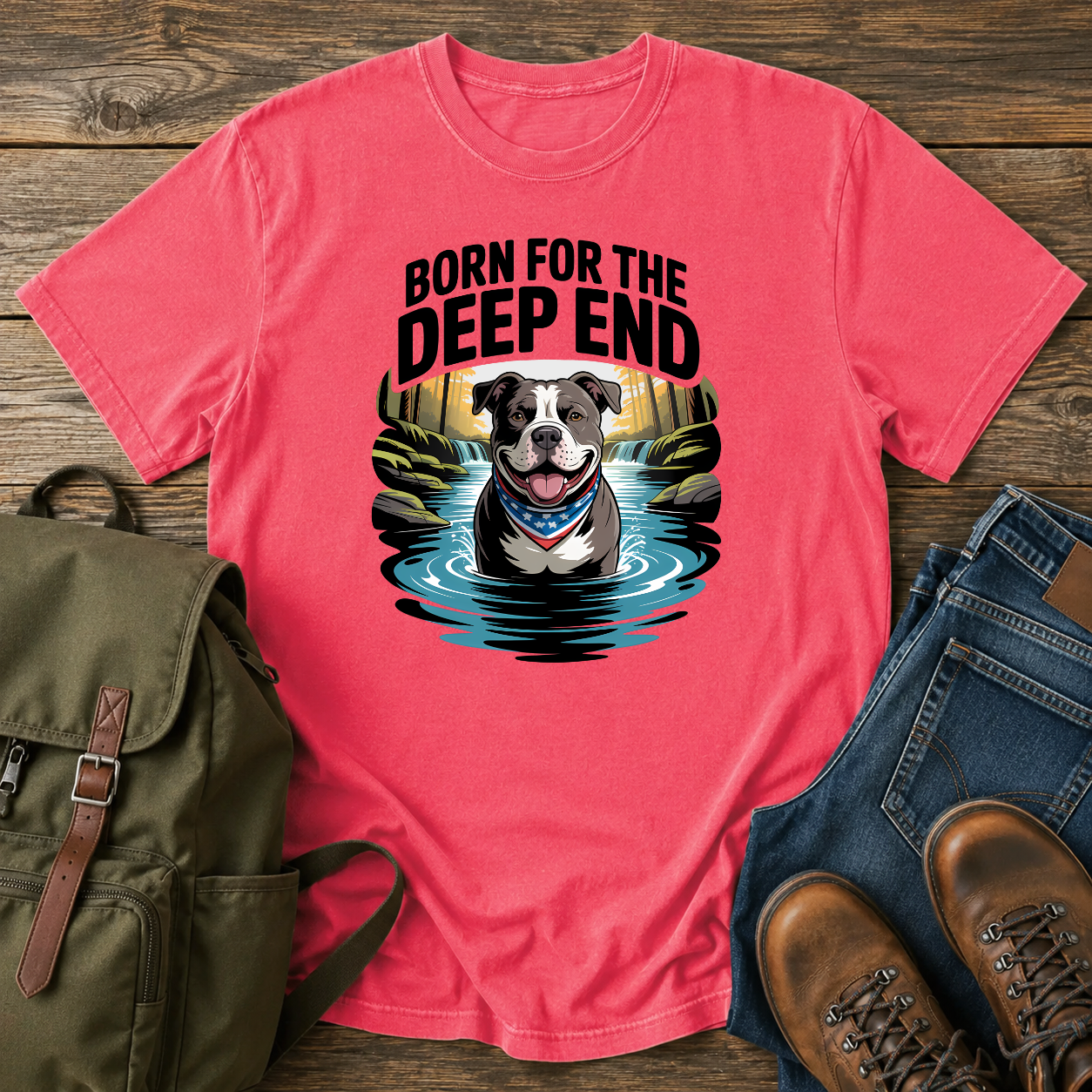 Smiling American Pit Bull Terrier with patriotic bandana standing in waterfall swimming hole on a vintage t-shirt.