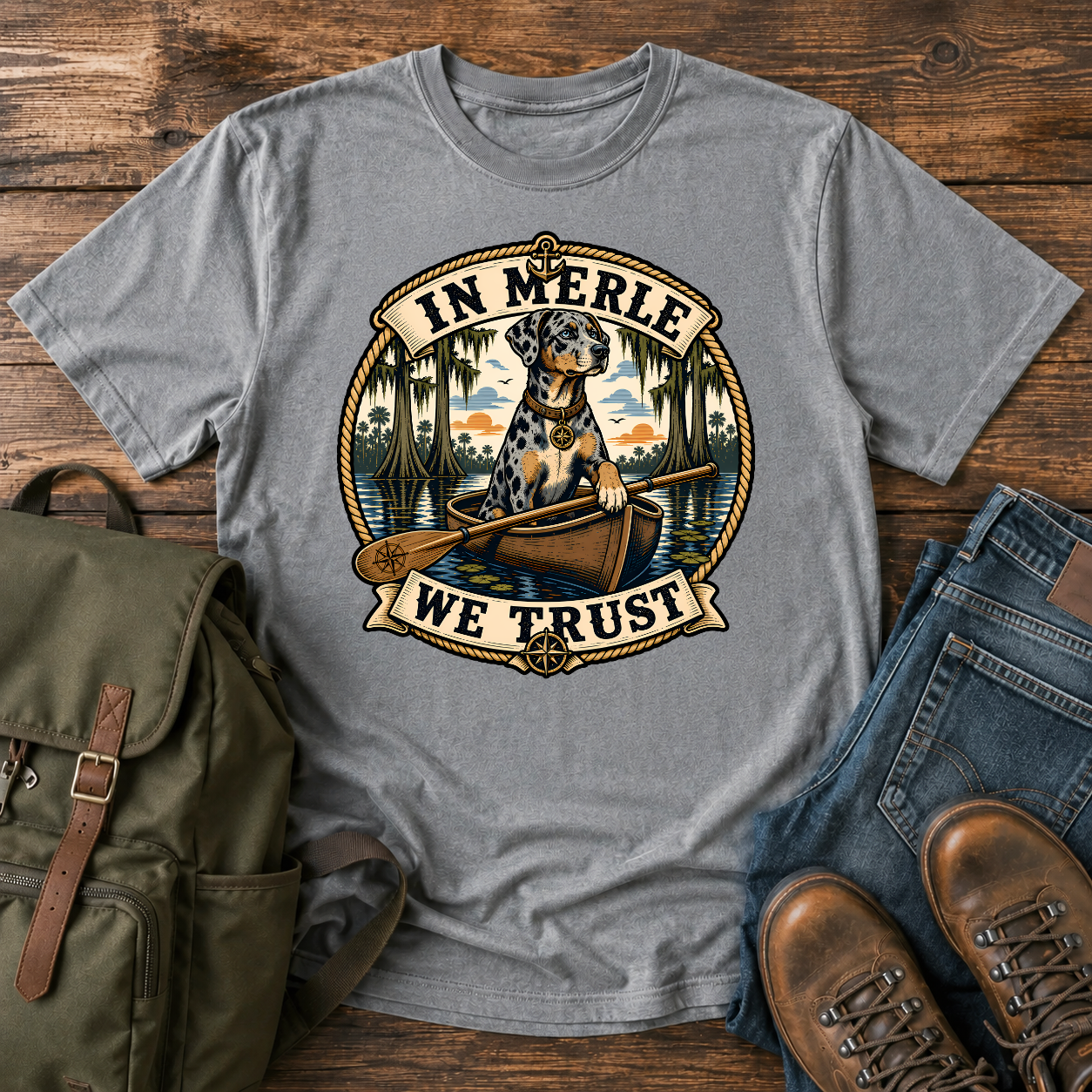 Nautical-style Catahoula Leopard Dog kayak shirt featuring a blue-merle dog paddling through cypress bayou.