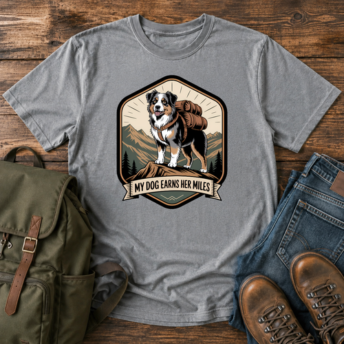 Retro trail-badge Australian Shepherd hiking shirt featuring an Aussie with a backpack on a mountain thru-hike trail.