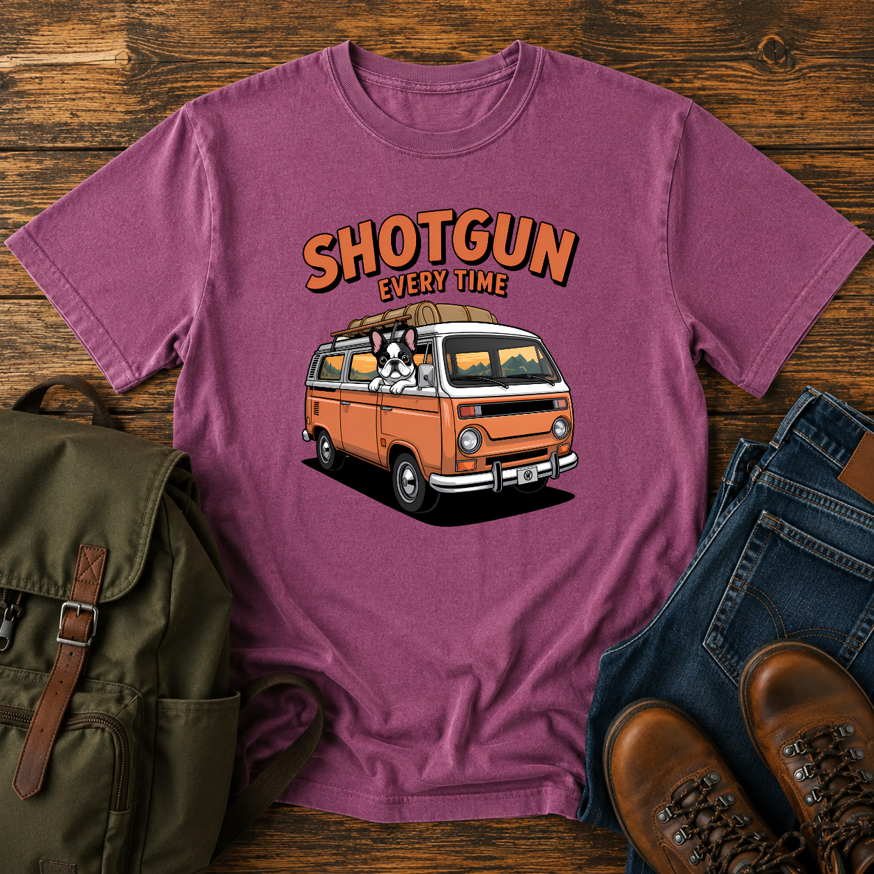French Bulldog sitting shotgun in a retro camper van with mountain scenery on a vintage-style t-shirt.