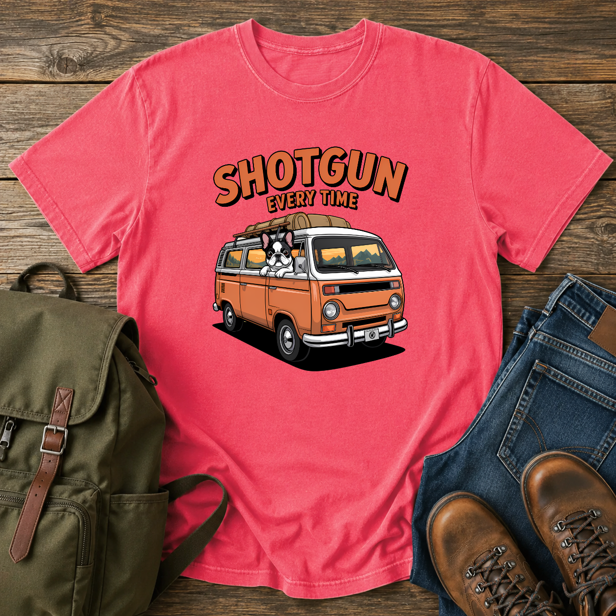 French Bulldog sitting shotgun in a retro camper van with mountain scenery on a vintage-style t-shirt.