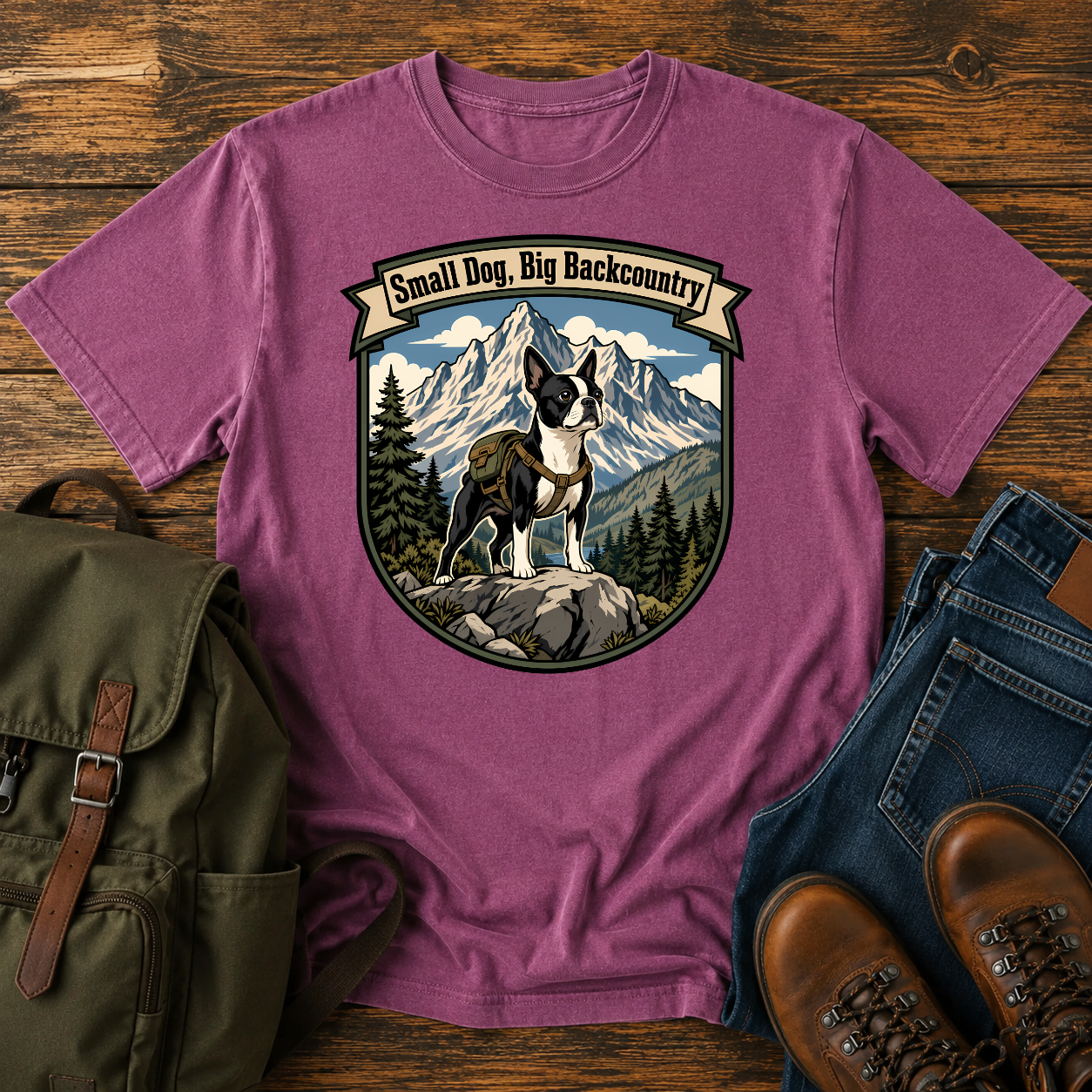 Boston Terrier hiking shirt with small dog on boulder above mountain valley.