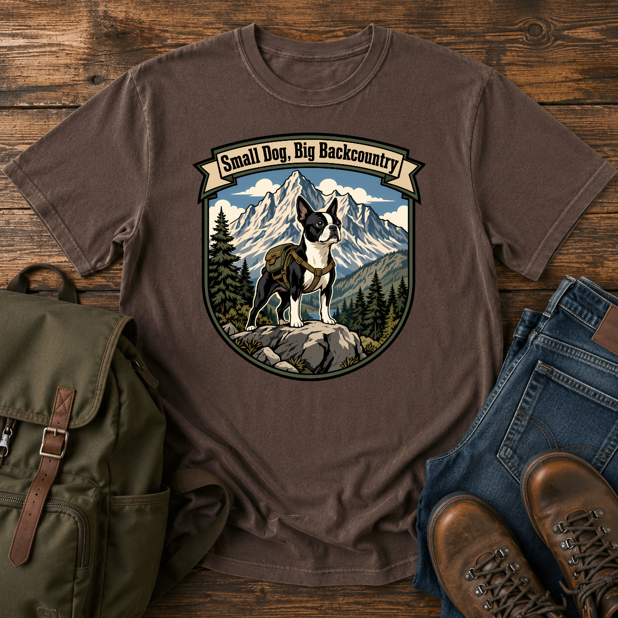Boston Terrier hiking shirt with small dog on boulder above mountain valley.