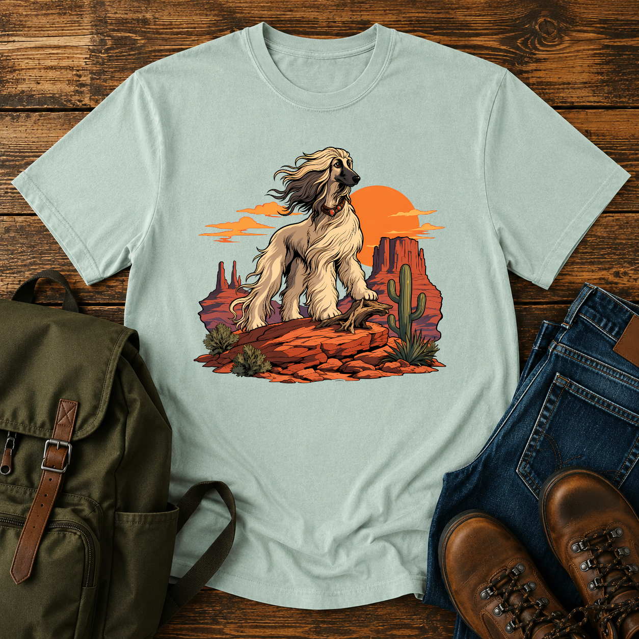 Afghan Hound standing on desert mesa rocks on a vintage western shirt.