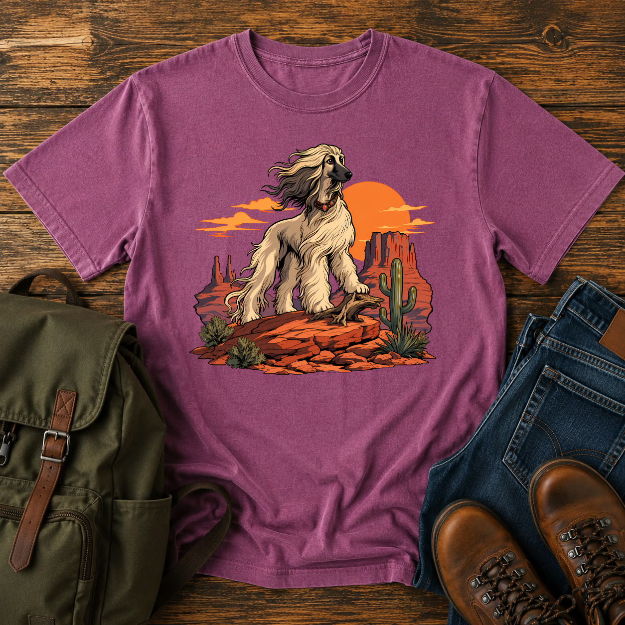 Afghan Hound standing on desert mesa rocks on a vintage western shirt.