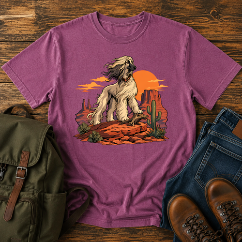 Afghan Hound standing on desert mesa rocks on a vintage western shirt.