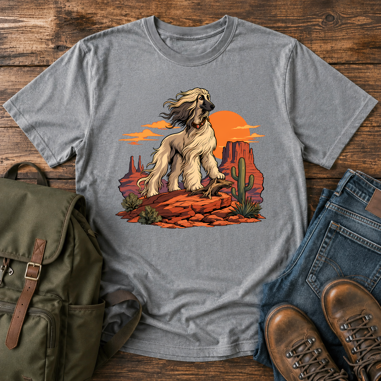Afghan Hound standing on desert mesa rocks on a vintage western shirt.