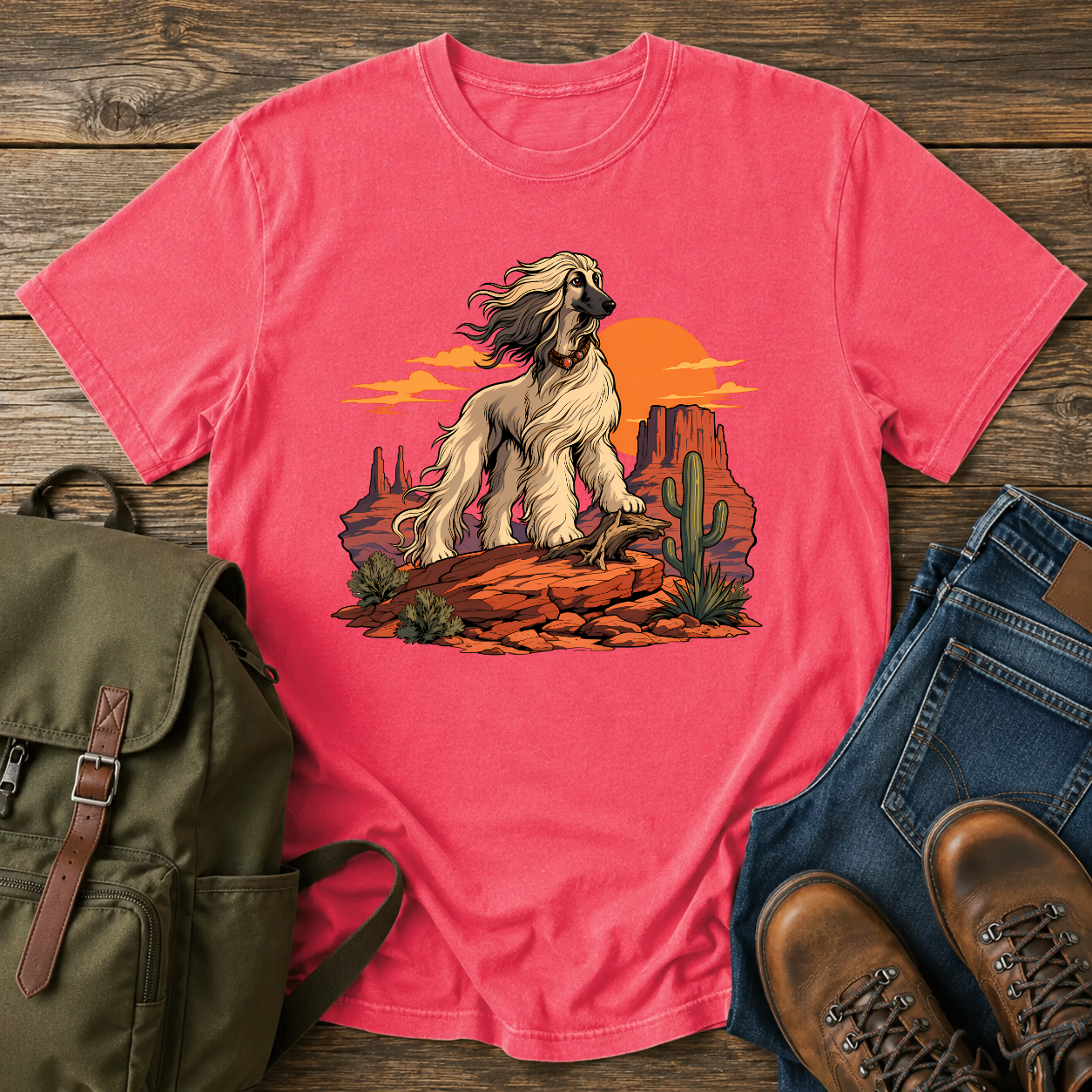 Afghan Hound standing on desert mesa rocks on a vintage western shirt.