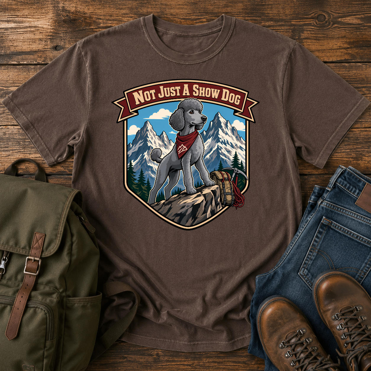Standard Poodle in a sporty short clip cresting an alpine ridge wearing a bandana t-shirt design