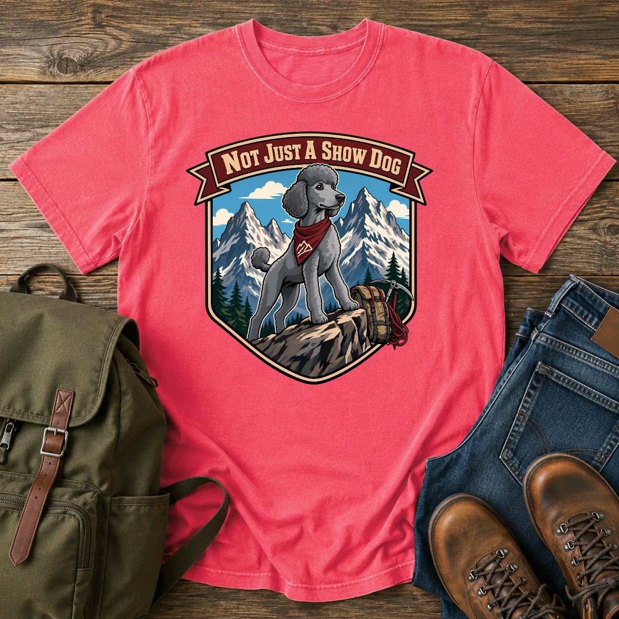 Standard Poodle in a sporty short clip cresting an alpine ridge wearing a bandana t-shirt design