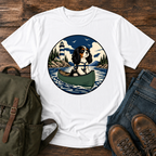 Cavalier King Charles Spaniel wearing a tiny life jacket sitting at the bow of a green t-shirt design