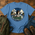 Cavalier King Charles Spaniel wearing a tiny life jacket sitting at the bow of a green t-shirt design