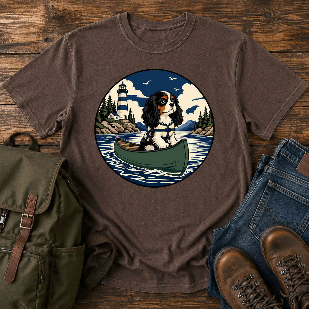 Cavalier King Charles Spaniel wearing a tiny life jacket sitting at the bow of a green t-shirt design