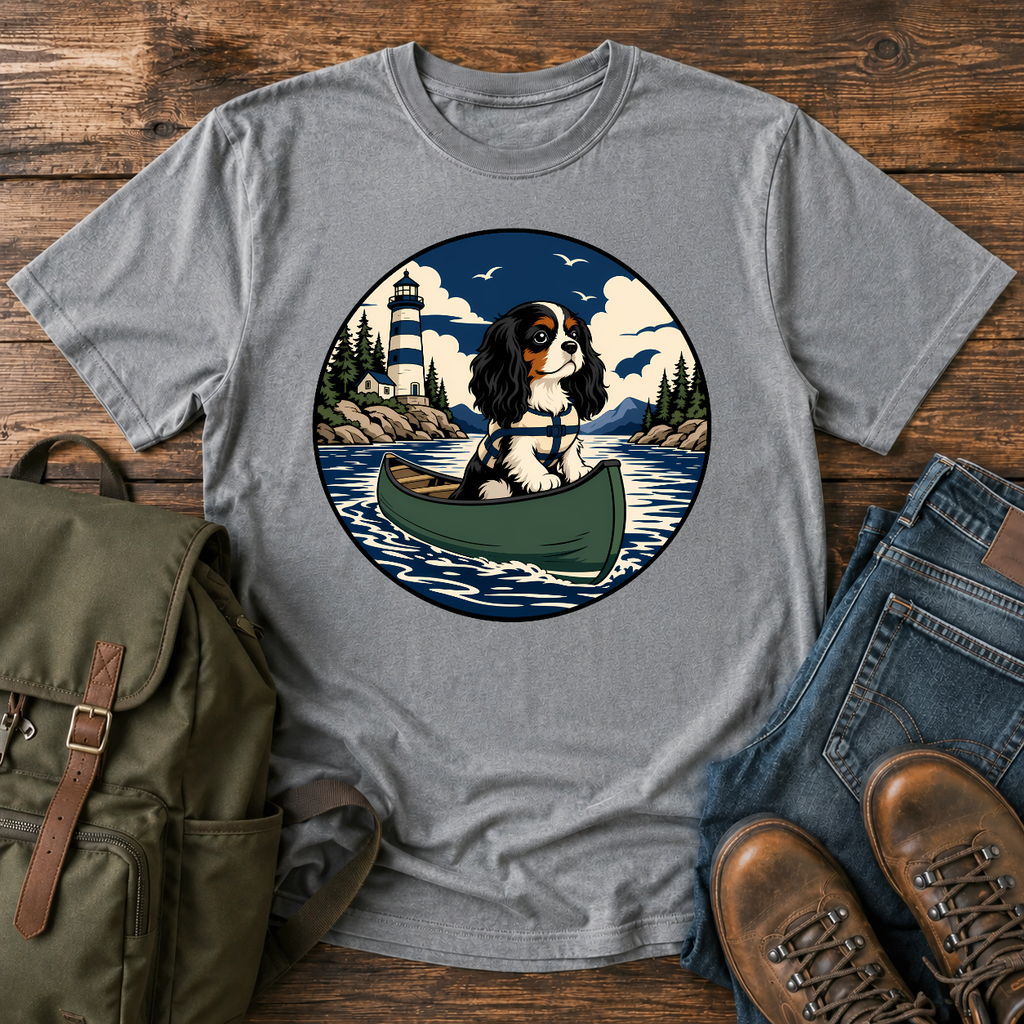Cavalier King Charles Spaniel wearing a tiny life jacket sitting at the bow of a green t-shirt design