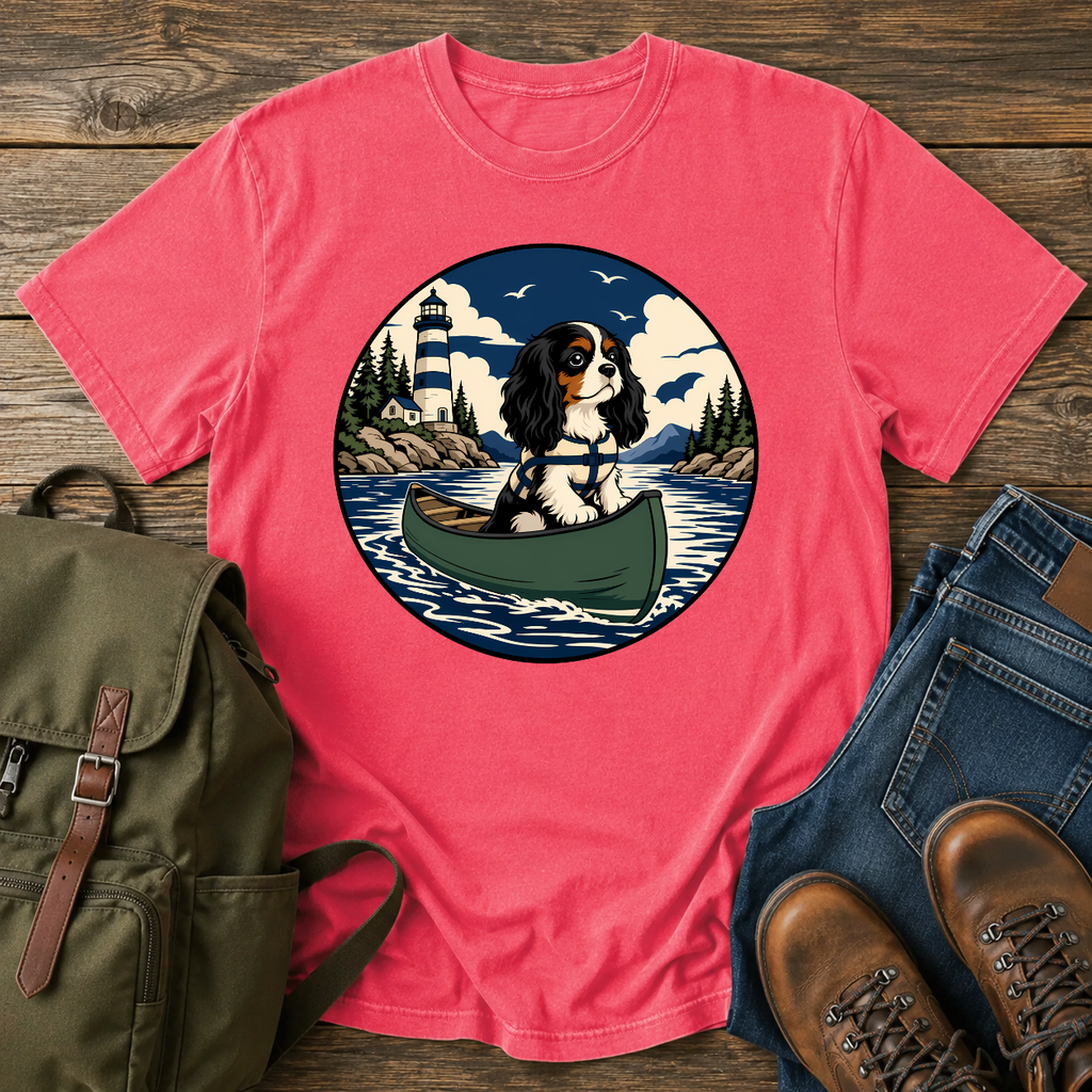 Cavalier King Charles Spaniel wearing a tiny life jacket sitting at the bow of a green t-shirt design