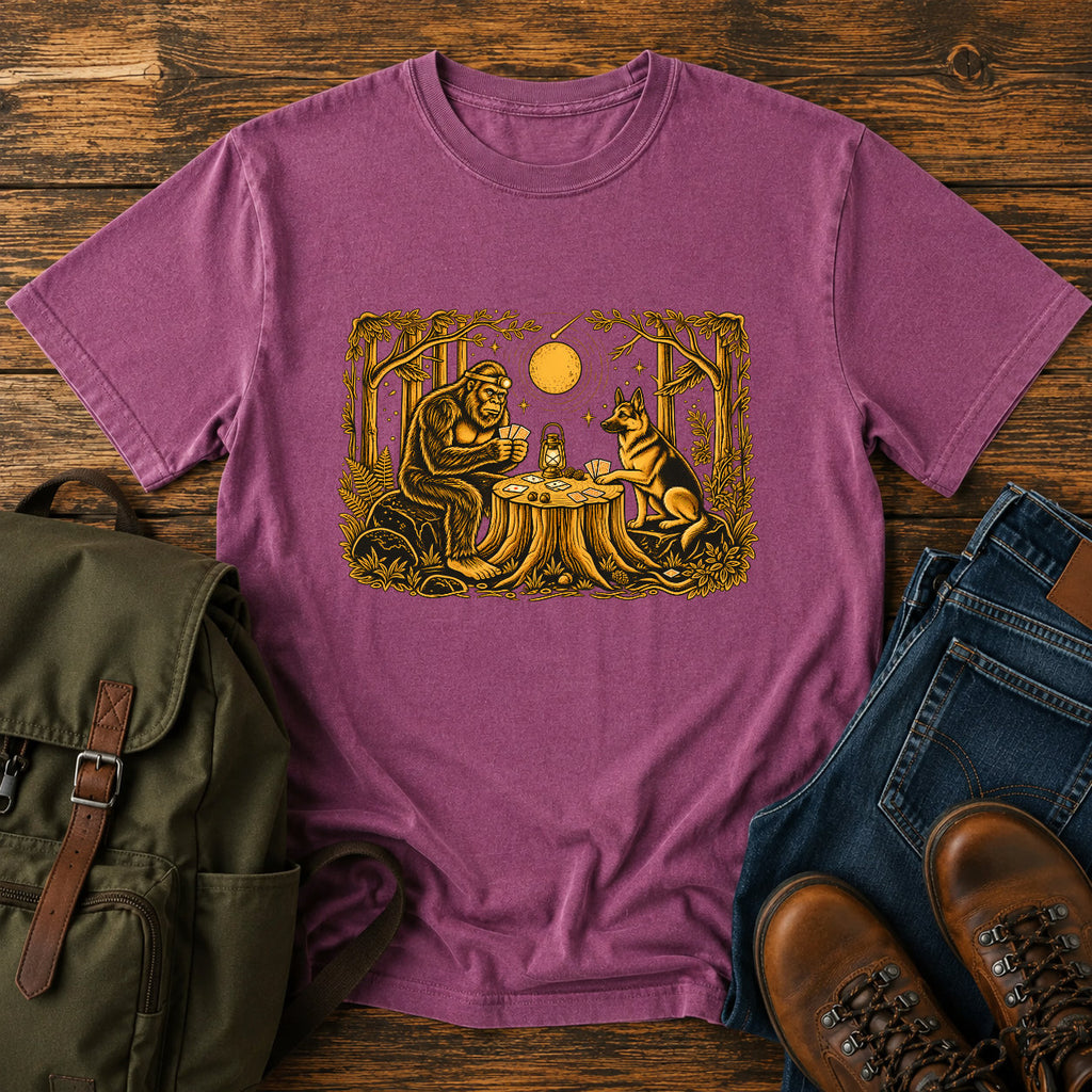 German Shepherd dog and Bigfoot playing poker in a moonlit forest on a t-shirt design.