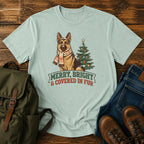 German Shepherd Christmas t-shirt design with scarfed dog beside a decorated tree.