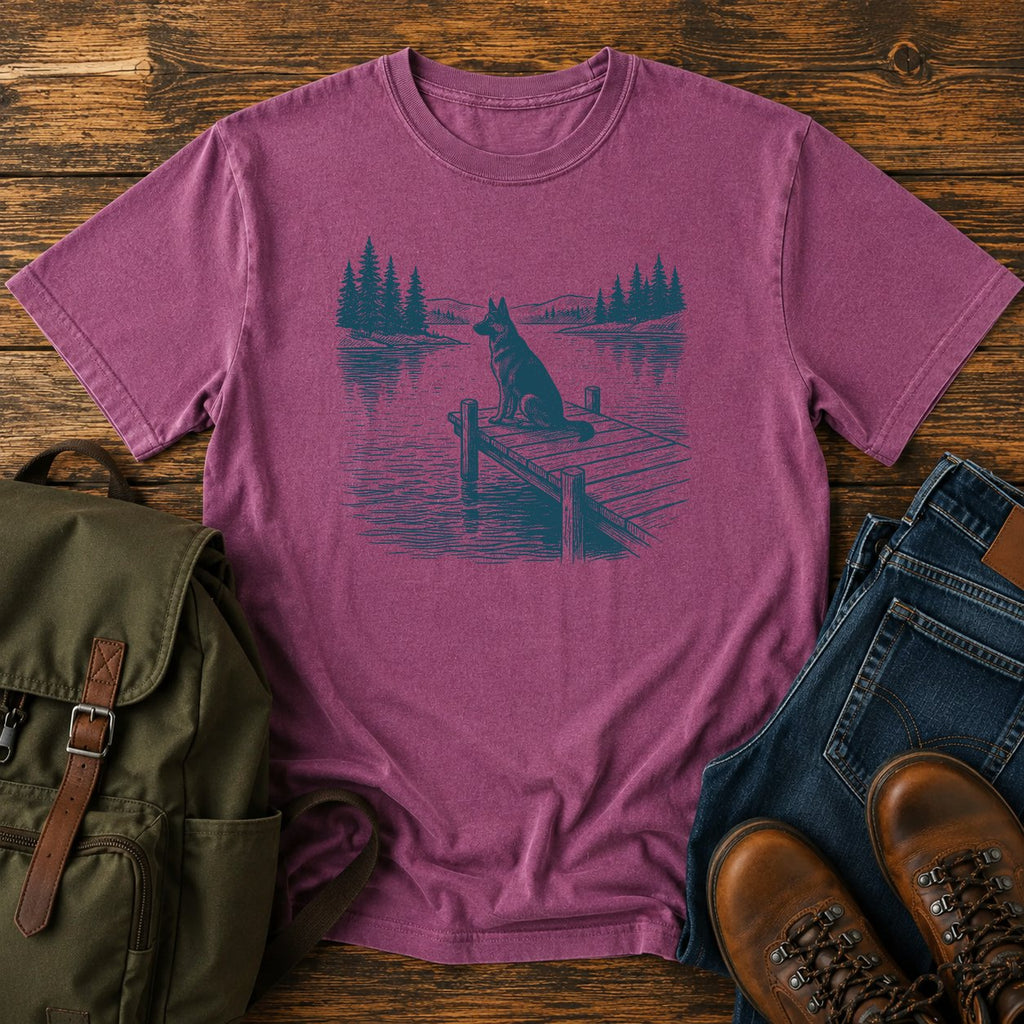 German Shepherd dock watch t-shirt design with alert dog by calm summer water.